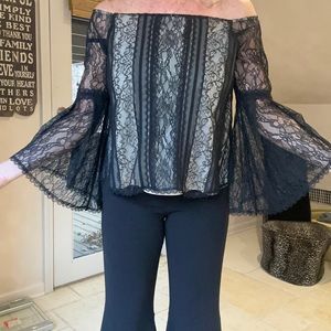 Alice + Olivia black lace top with white lining.
